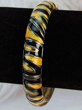 Vintage black and mustard tone swirl, hinged, bangle bracelet